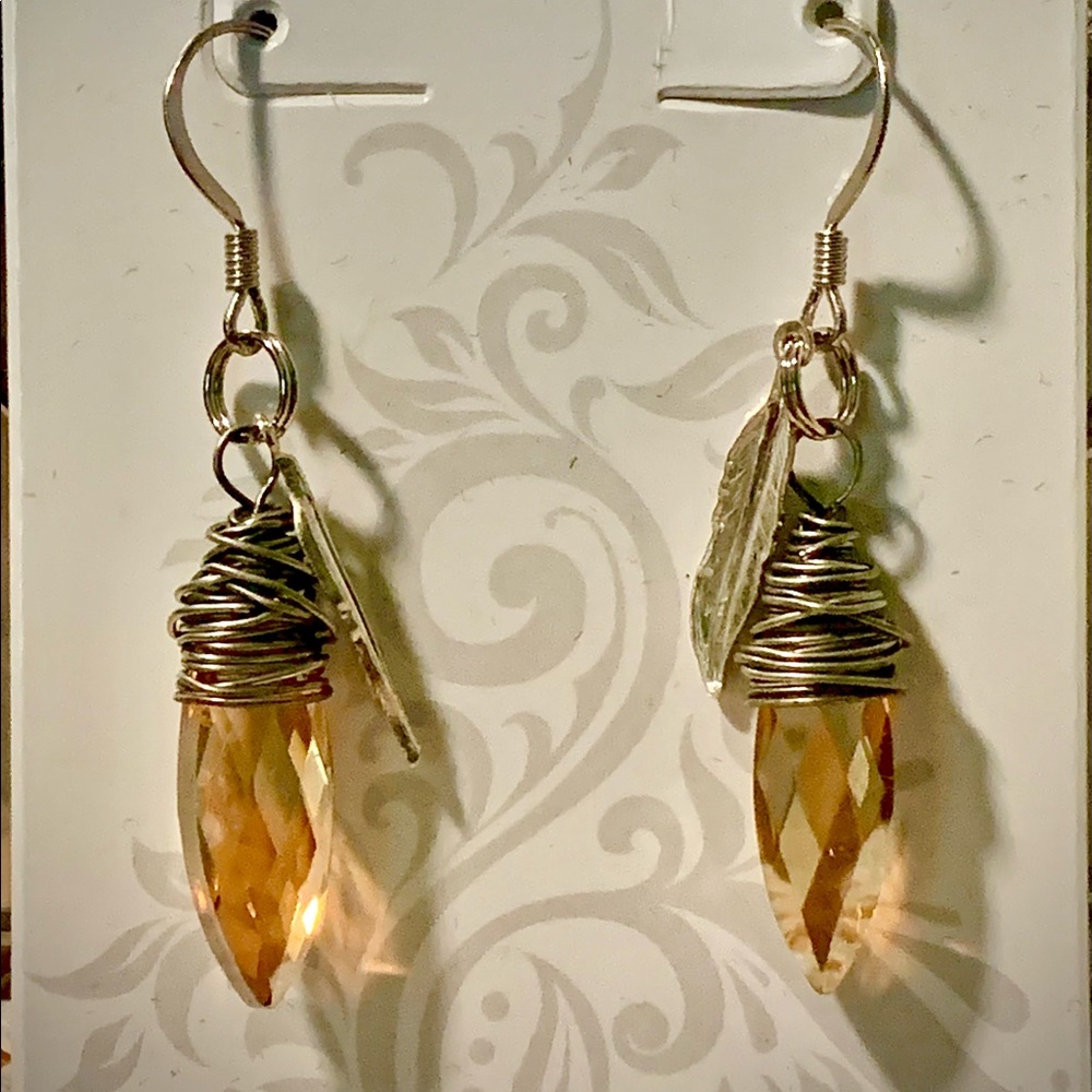 DragonsFancy topaz colored silver drop earrings with feather
